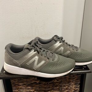 Practically new new balance sneakers size 8 in an army green color